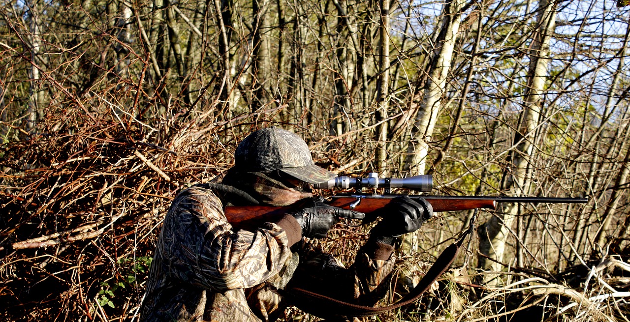 a hunter using a rifle with ffp scope